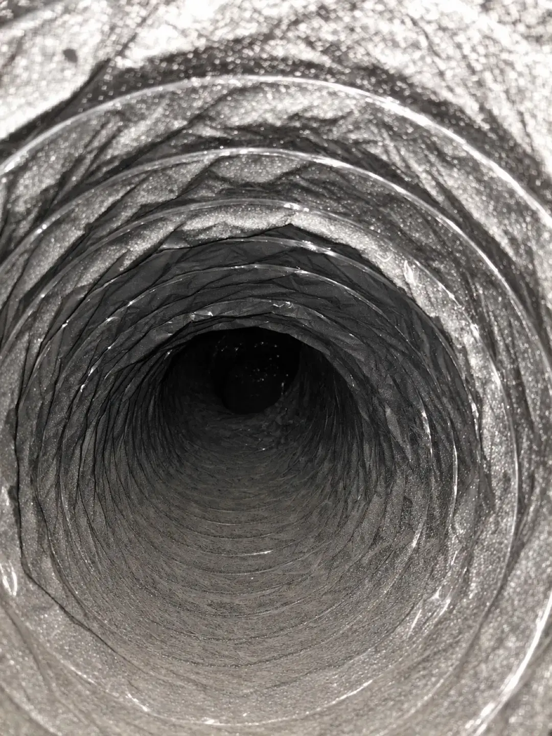 Inside a clean flexible air duct after professional cleaning in Aventura, FL