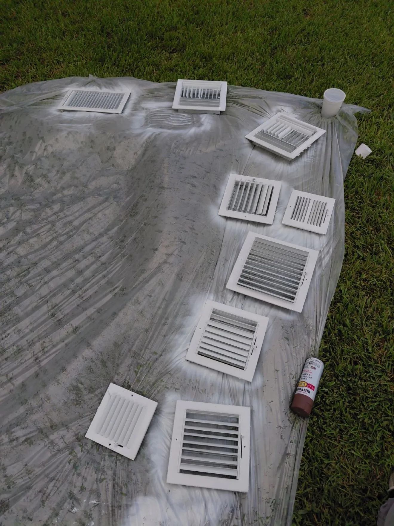 Air vent covers being cleaned and disinfected during service