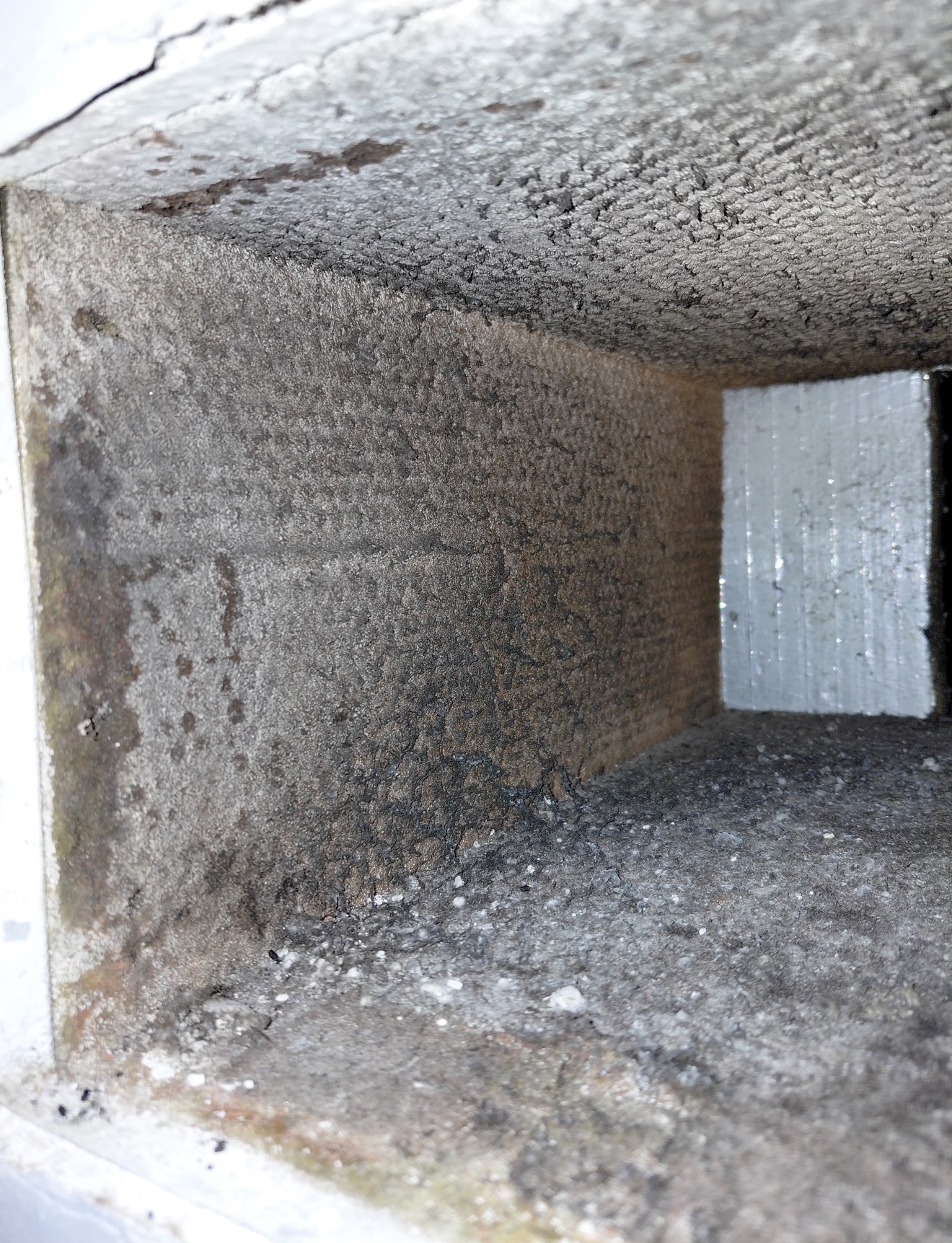 Dirty duct interior with heavy buildup before Fair Air Solutions cleaning